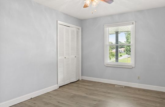 bedroom, luxury vinyl flooring, closet, window, ceiling fan