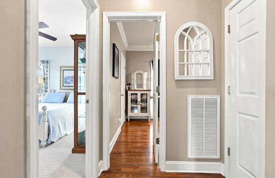 hallway view toward bedrooms, hardwood flooring