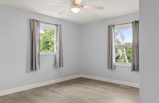 bedroom, windows, ceiling fan, luxury vinyl flooring