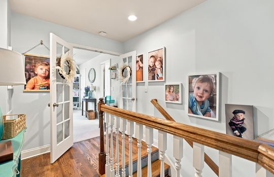 landing, hardwood flooring, double doors to bedroom