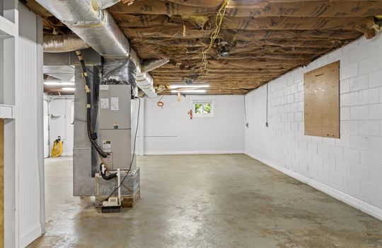 garage space, concrete flooring, block walls