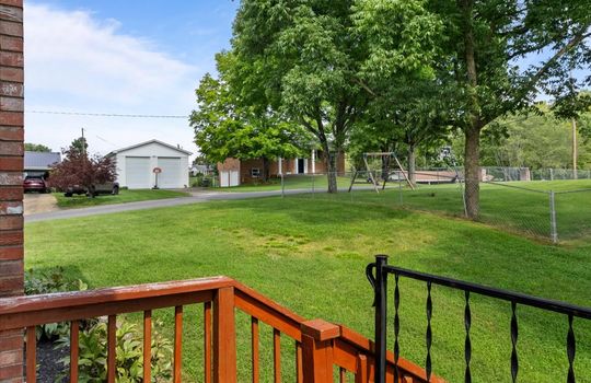 side porch view toward yard, yard, neighboring homes