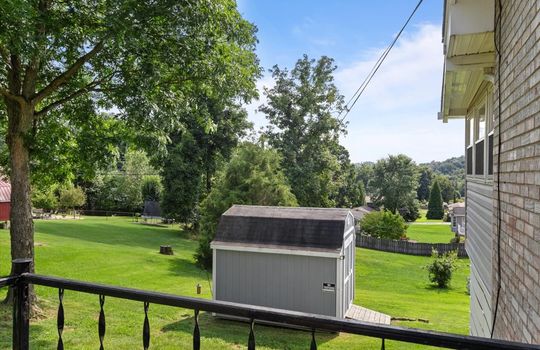 side porch view toward back yard, storage shed, yard