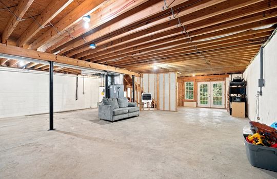 basement, unfinished basement, walk-out exterior access doors, concrete flooring