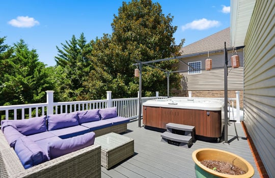 back deck, hot tub, deck railings, vinyl siding