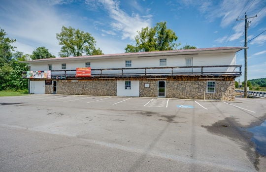 Commercial Space for Lease, stone & vinyl siding exterior, parking lot, glass door, road