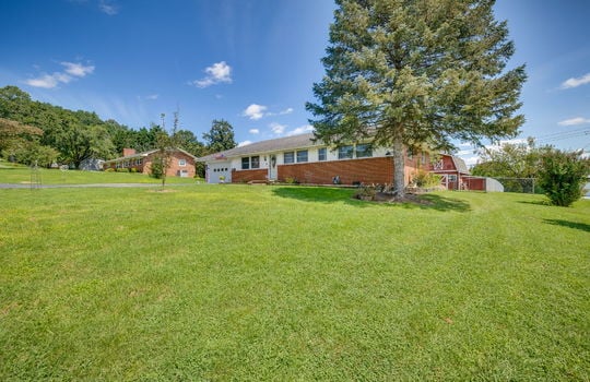 brick ranch, fencing, front yard, front door, ranch style home, brick, vinyl siding, garage, garage door, landscaping