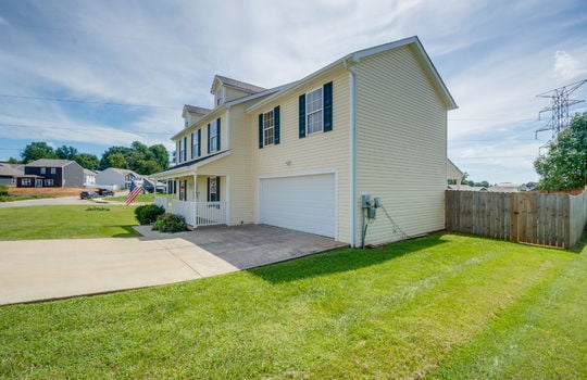 traditional style home for lease, garage, driveway, front porch, covered front porch, landscaping, vinyl siding, shingle roof, fencing, front yard