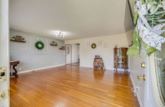 living room, front door, hardwood flooring