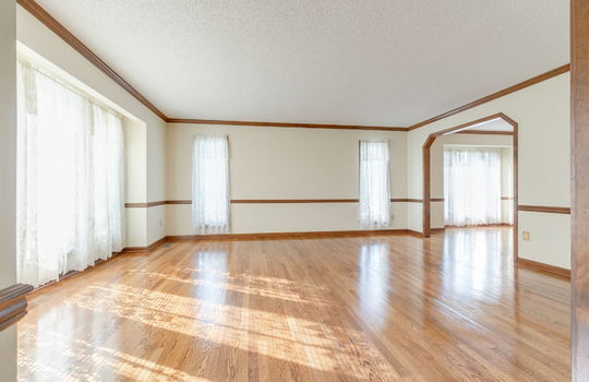 living room, wood trim, hardwood flooring, windows,