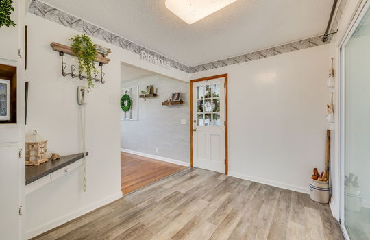 eat in kitchen space, dining space, side door, door to heated sunroom, luxury vinyl flooring