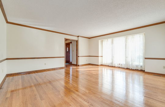 living room, wood trim, hardwood flooring, window