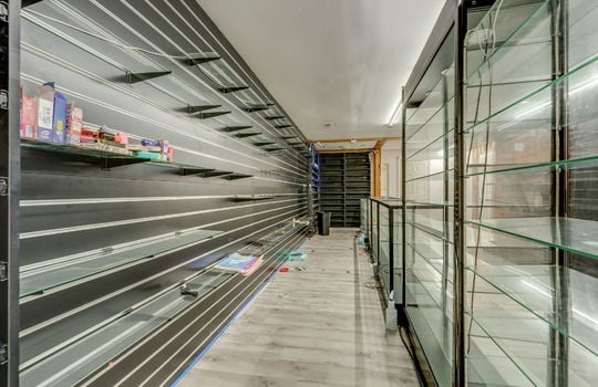 glass display case, display racks, vinyl flooring, shelving