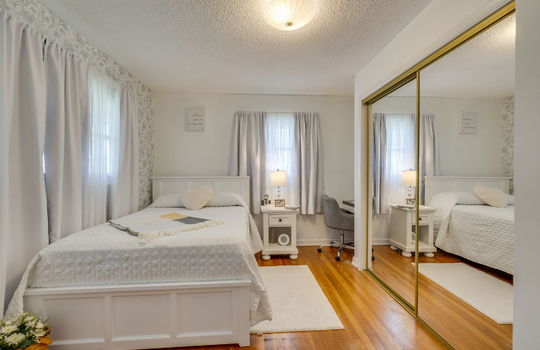 second bedroom, hardwood flooring, closet, windows