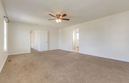 bedroom, carpet, ceiling fan, door to ensuite bathroom