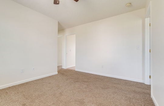 bedroom, carpet, ceiling fan, doorways