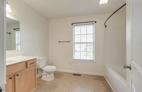 second bathroom, shower/tub, toilet, sink, window