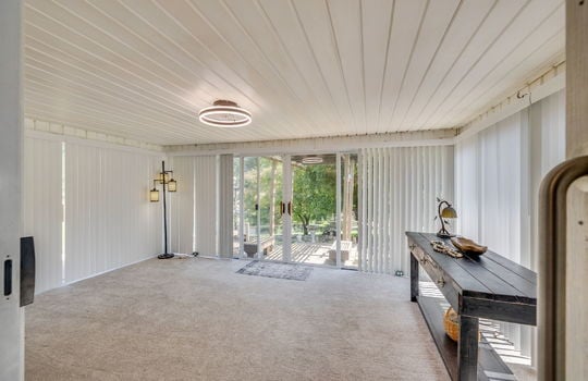 heated sunroom, windows, fan/chandelier, carpet