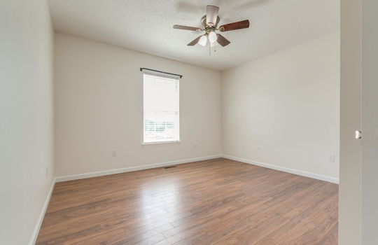 bedroom, luxury vinyl flooring, ceiling fan, window