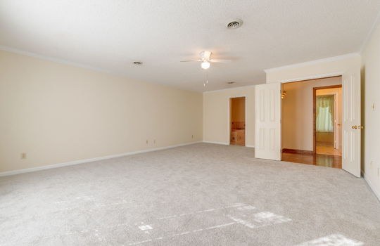 bedroom, carpet, ceiling fan, doors