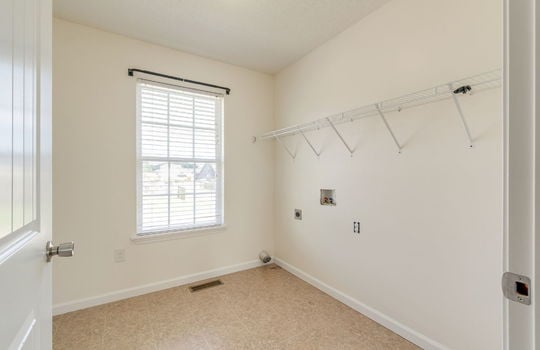 laundry room, washer/dryer hookups, wire shelving, window