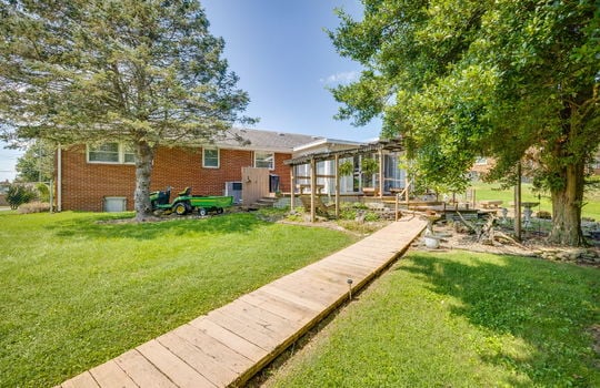 back of home, landscaping, fenced back yard, landscaping, trees