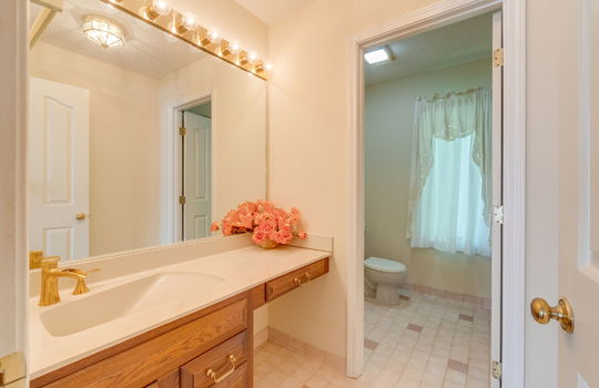 bathroom, toilet, tile flooring, sink