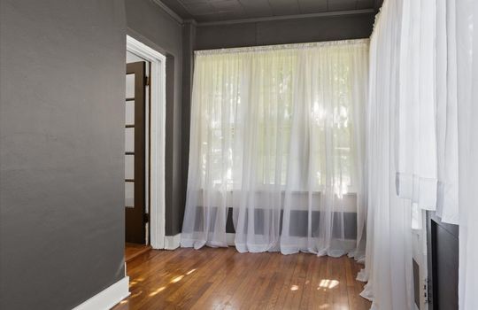 sunroom, hardwood flooring, windows, door