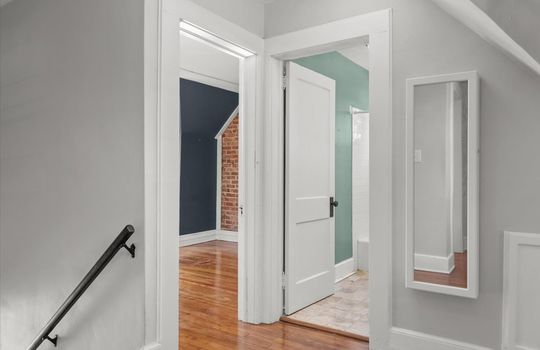upper level landing, door to bathroom, door to bedroom, stairs
