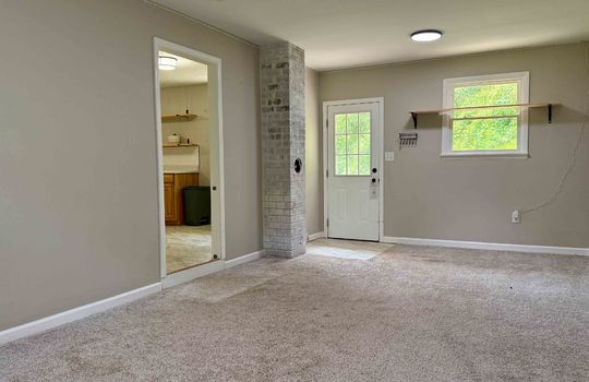 family room/den, carpet, exterior door, window