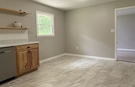 eat in kitchen, window, door to den/family room