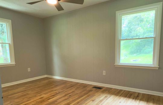 bedroom, hardwood flooring, ceiling fan, windows