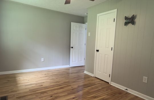 bedroom, closet, ceiling fan, hardwood flooring, window