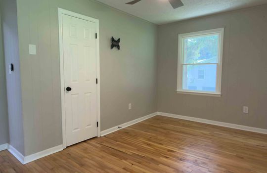 bedroom, closet, hardwood flooring, window, ceiling fan