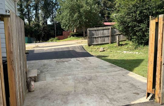 new asphalt driveway, fencing, gated fence,
