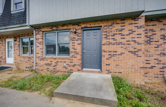 front door, front stoop, brick exterior, wood siding exterior