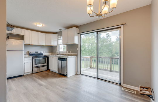 kitchen, kitchen/dining combo, sliding door to back balcony, refrigerator, oven/range, dishwasher, cabinets, countertops