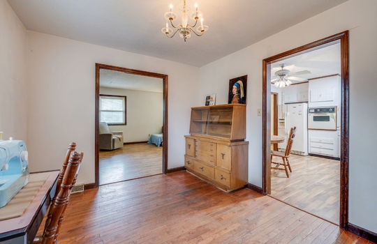 dining space, hardwood flooring, doorway to living room, doorway to kitchen