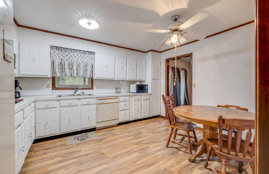 kitchen, kitchen cabinets, kitchen countertops, sink, dishwasher, hardwood flooring, eat-in kitchen area