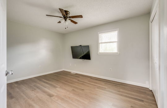 bedroom, ceiling fan, vinyl flooring, closet, window
