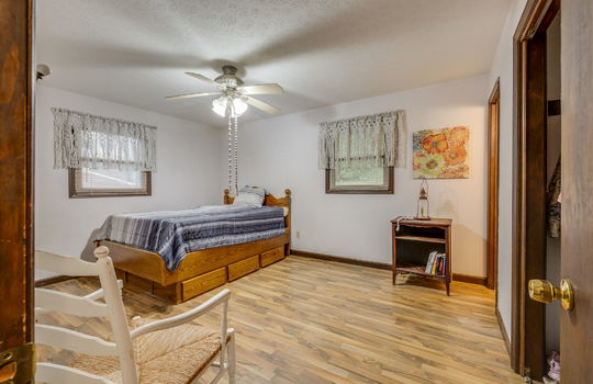 bedroom, hardwood flooring, closet, windows, ceiling fan