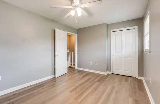 bedroom, closet, ceiling fan, window, vinyl flooring