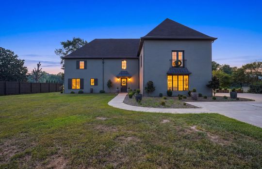 Twilight Photo, front yard, sidewalk, French Provincial Home, Two Story home, front door, fencing, concrete driveway, landscaping