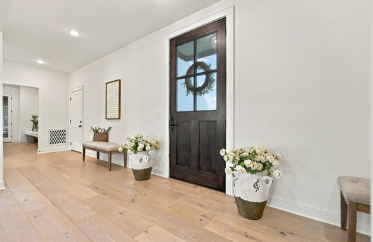foyer, hardwood flooring, front door, mud room