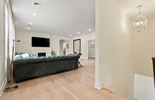living room, hardwood flooring, stairs, recessed lighting, hallways