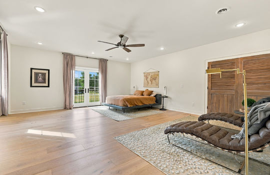 bedroom, hardwood flooring, closet, french doors to balcony, recessed lighting, ceiling fan