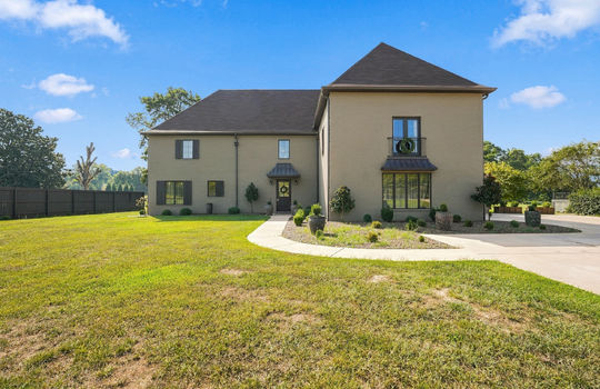 front yard, driveway, concrete driveway, sidewalk, brick exterior, French Provincial home, shingle roof, front door