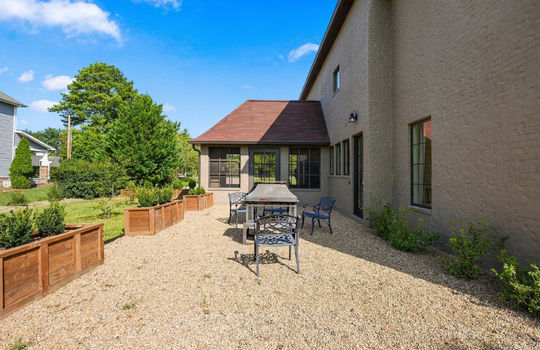 back yard, seating area, screened porch, brick exterior