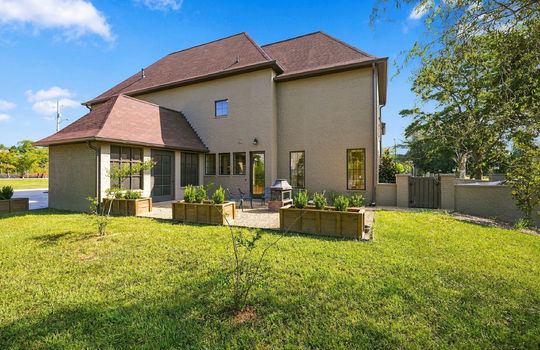 side yard, screened porch, brick exterior, exterior entry doors