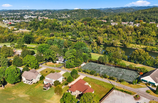 aerial view of home, neighboring homes, golf course, Ridgefields Golf Course, Mountain Views, golf course club house, tennis courts
